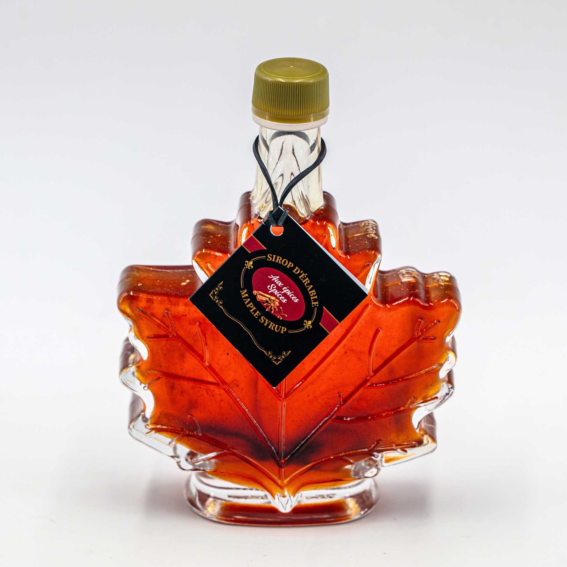 Infused mape syrup spices nature Artisan 100 ml in a maple leaf shaped bottle.
