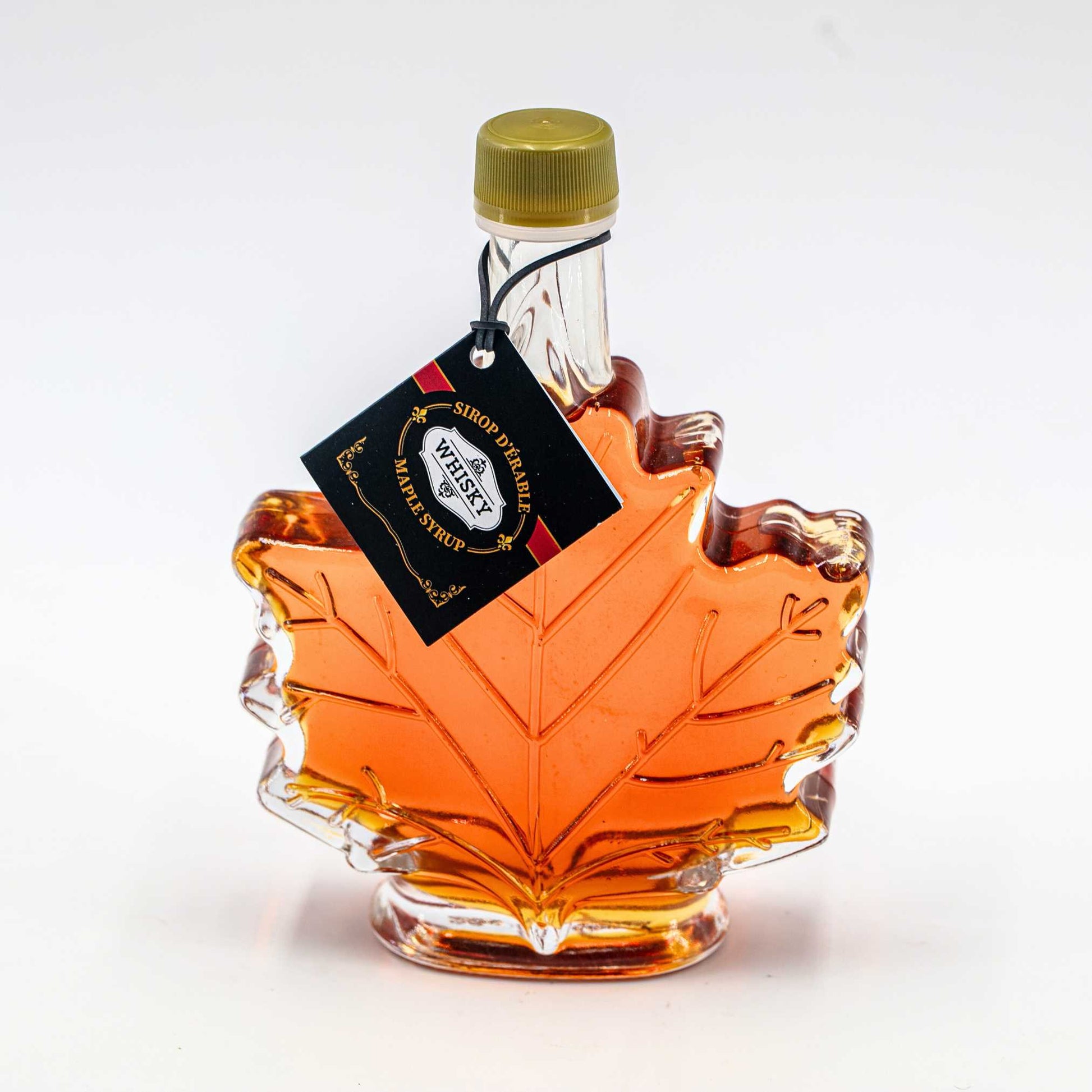 Infused maple syrup whiskey Nature Artisan 100 ml in a maple leaf shaped bottle.
