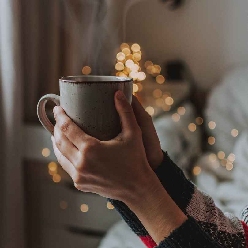 A warm mug of infused herbal tea - Nature Artisan