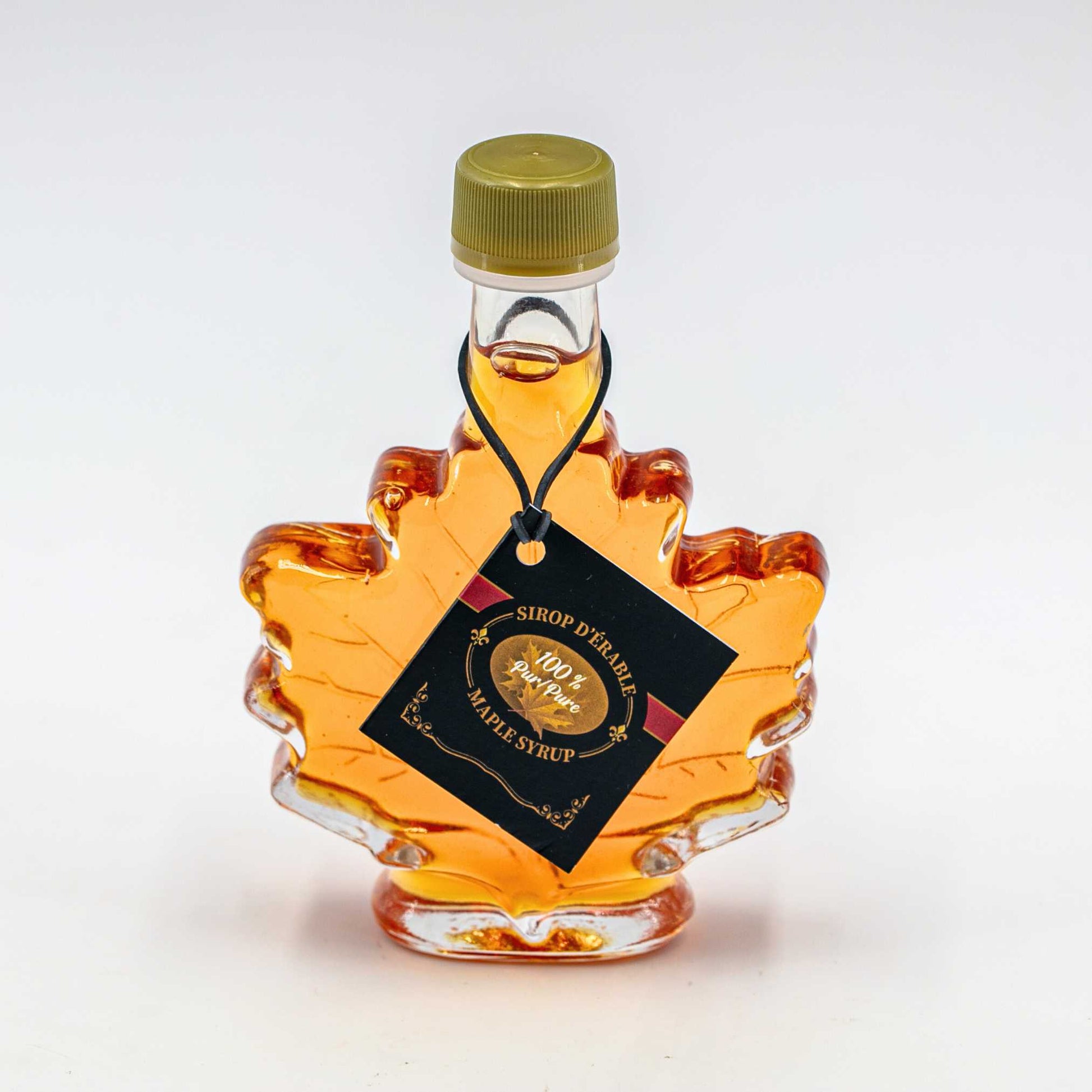 Maple syrup 100% pur Nature Artisan 100 ml in a maple leaf shaped bottle.